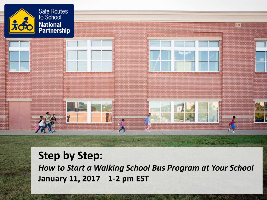 Kids walking on a sidewalk in front of a school